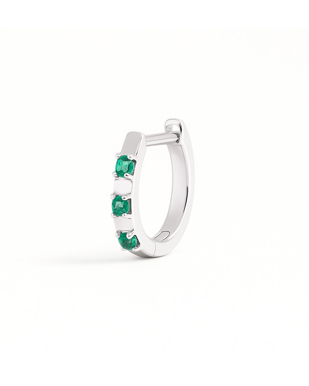 COVETEAR White Gold hoop earring with EMERALD gemstones on a white background