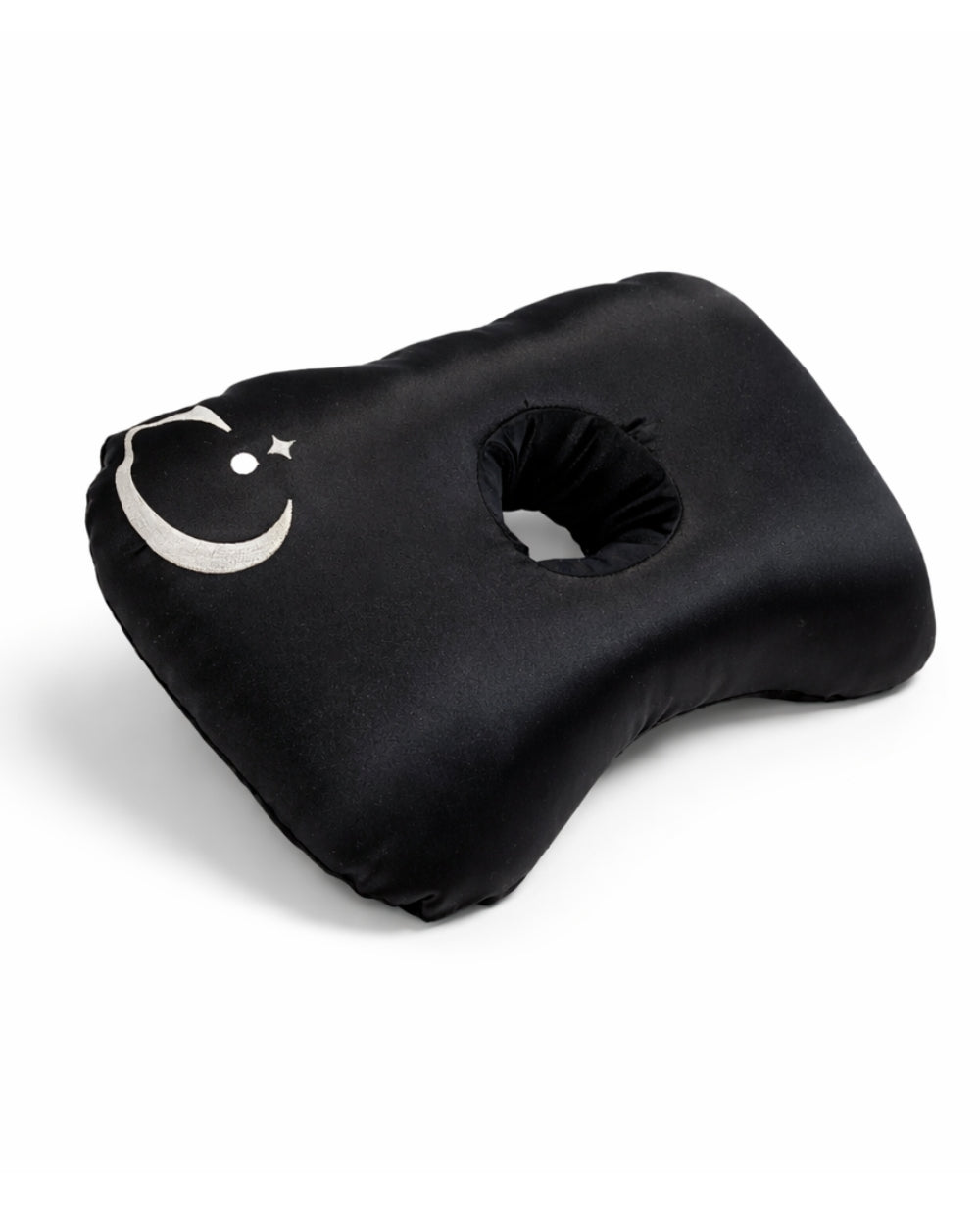 Black ear piercing pillow with hole for ear and a logo design