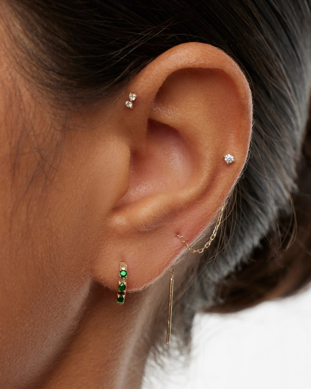 Covetear model wearing green emerald hoop earring