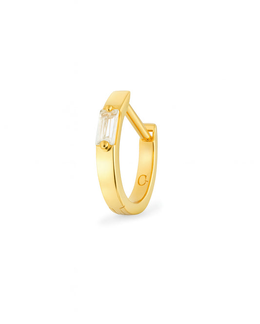 Gold hoop earring with a baguette gemstone on a white background