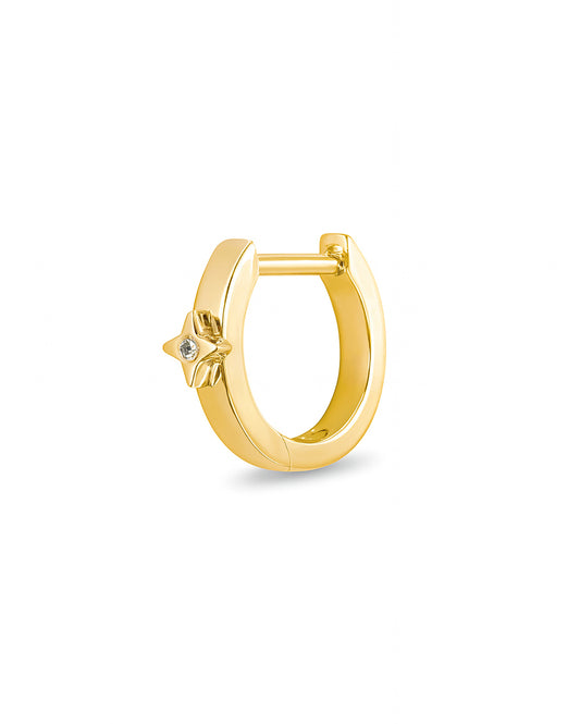 Gold Covetear hoop earring with a small star diamond on a white background